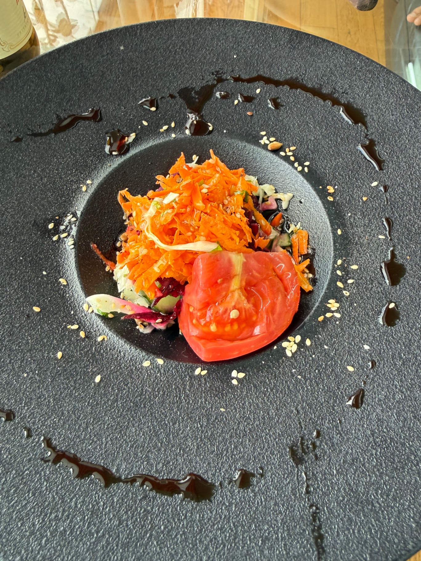 Fresh vegetable salad on a dark stone plate